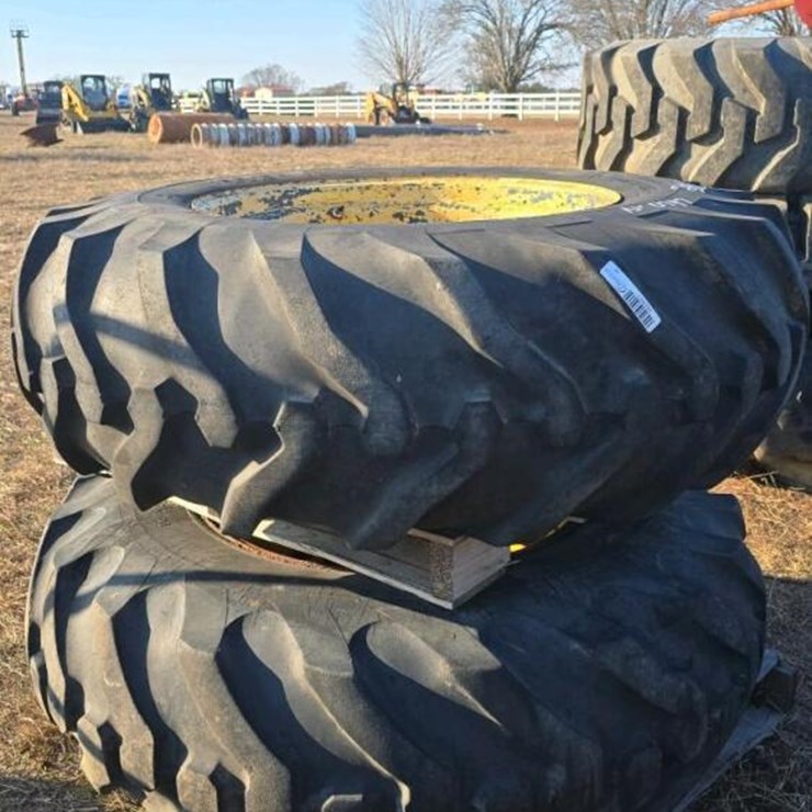 (2) 16.9-28 TIRES W/ JD RIMS