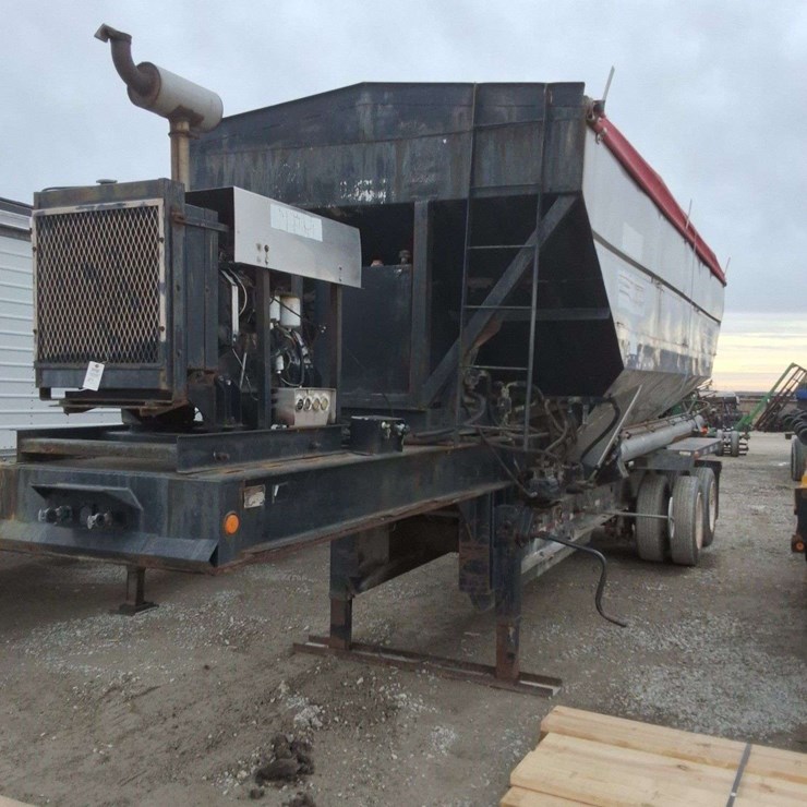 Adams Semi Dry fertilizer tender with engine, side auger unload