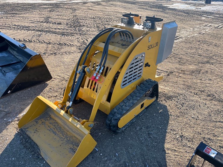 stand-on-skid-steer-image-1