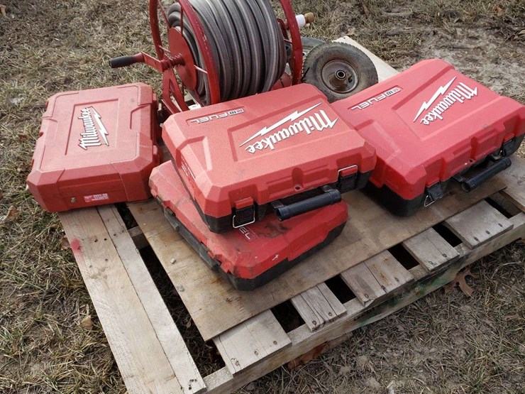 4-milwaukee-hard-cases-and-garden-hose-reel,-and-2-4.10/3.50-tires-image-1