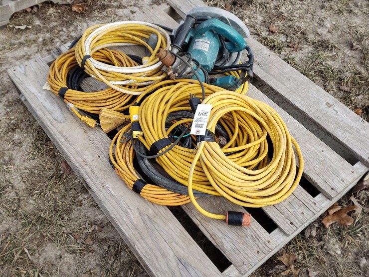 pallet-of-extension-cords,-some-are-taped,-electric-drill-and-saw-image-1