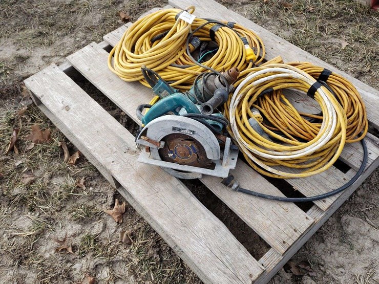 pallet-of-extension-cords,-some-are-taped,-electric-drill-and-saw-image-2