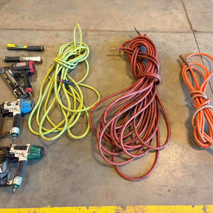 Assortment of Nail Guns and Hose