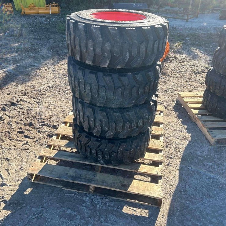 Set 4 - 12-16.5 tires on wheels for bobcat