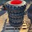 set-4---10-16.5-tires-on-wheels-for-bobcat-image-1