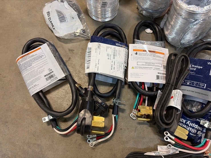 assortment-of-dryer-chords,-vent-tubes,-wash-machine-hoses,-and-range-power-cords-image-2