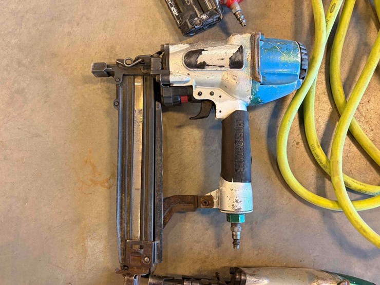 assortment-of-nail-guns-and-hose-image-7