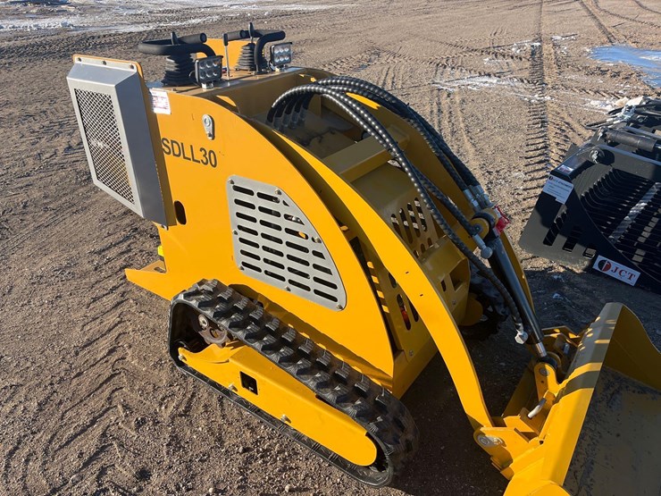 stand-on-skid-steer-image-4