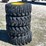 lot-of-4-12-16.5nhs-skid-steer-wheels-and-tires-image-1