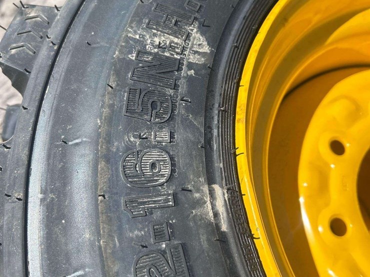 lot-of-4-12-16.5nhs-skid-steer-wheels-and-tires-image-3