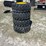 lot-of-4-12-16.5nhs-skid-steer-wheels-and-tires-image-2