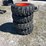 lot-of-4-10-16.5nhs-skid-steer-wheels-and-tires-image-2
