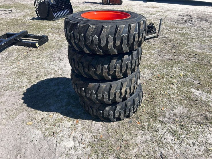 lot-of-4-10-16.5nhs-skid-steer-wheels-and-tires-image-2