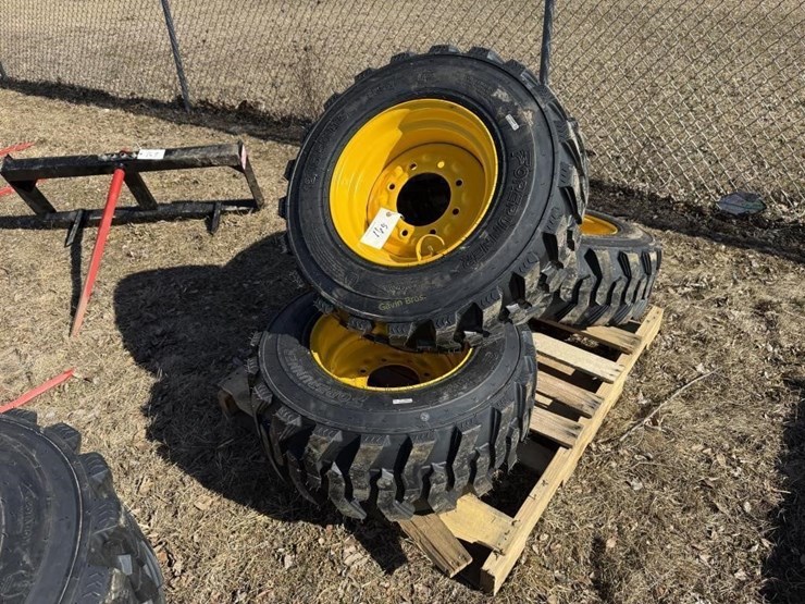 (4)-new-12-16.5-skidsteer-tires-w/rims-image-1