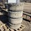 (4)-used/bald-12-16.5-skidsteer-tires-w/rims-image-1