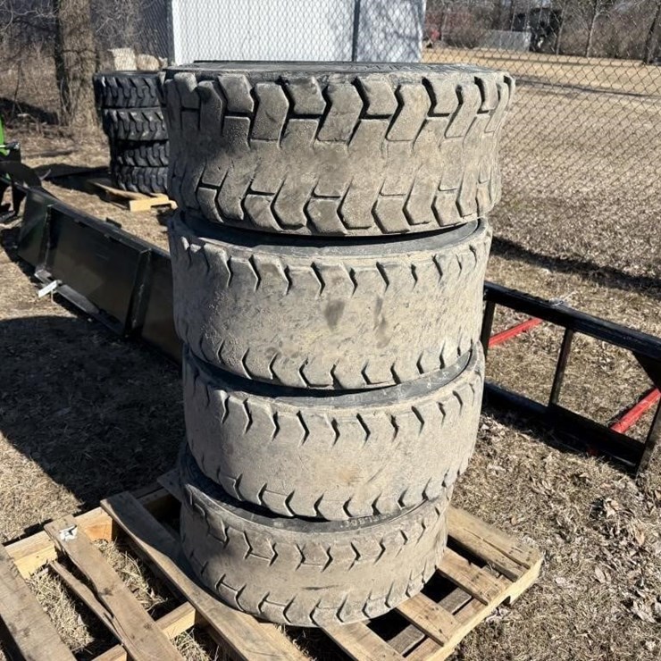(4) Used/Bald 12-16.5 Skidsteer Tires w/rims