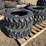 (4)-new-10-16.5-skidsteer-tires-image-1