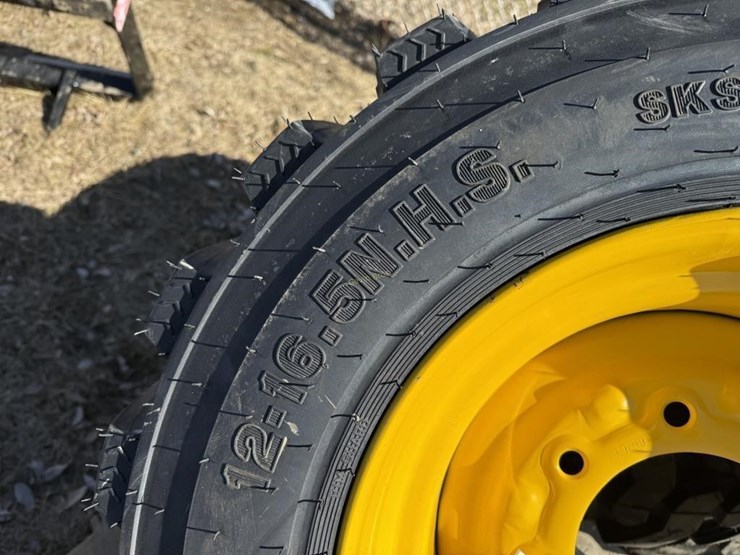 (4)-new-12-16.5-skidsteer-tires-w/rims-image-4