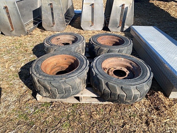 4----10-16.5-skidsteer-tires-on-8-bolt-rims-image-1