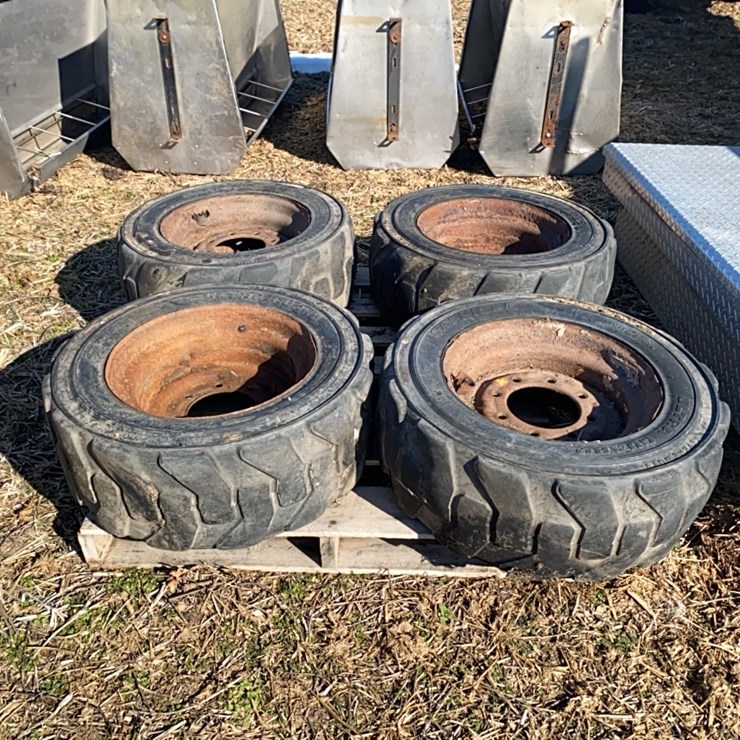 4 -  10-16.5 Skidsteer Tires on 8 bolt rims