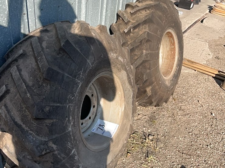 excellent-set-of-grip-tires,-size-is-16.5-l-–-16.1.--came-off-of-versatile-or-john-deere-self-propelled-swather,-always-been-stored-inside-image-1