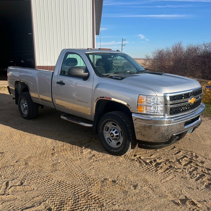 Lot 7. 2012 Chevy 3/4 ton 4wd gas pickup, reg cab long box, automatic trans., gas, cloth bench seat, Note: Endgate is stored in shop and is included in sale, 91,300 miles, VIN 1GCOKVCG8CF237093