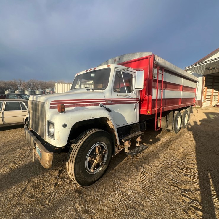 Lot 12. 1981 IH tandem twin screw grain truck, very good 19’ Strong Box and hoist, roll tarp, 466 diesel, 5+4 
VIN AF195BCA10481