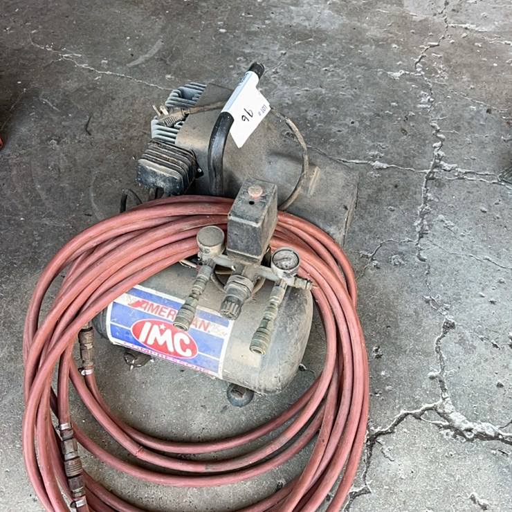 Portable carry along type air compressor with hose