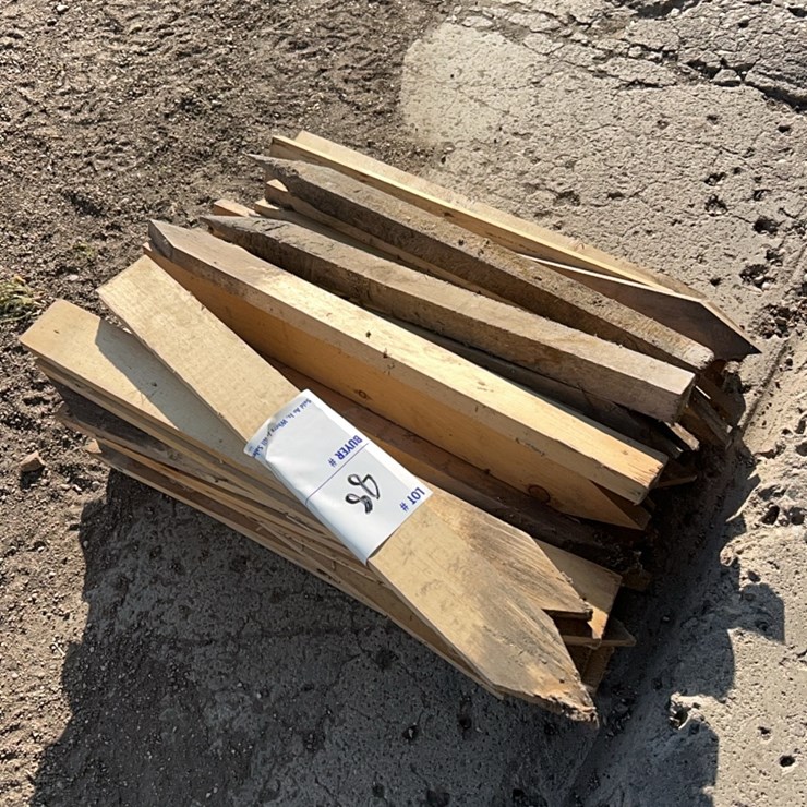 Large pile of wooden stakes
