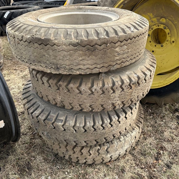 (4) 10.00-20 GOODYEAR TIRES ON RIMS (HESS)
