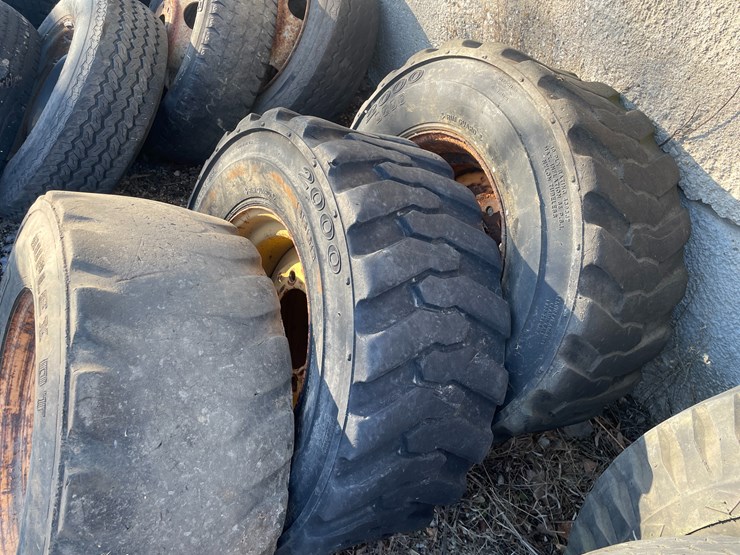 #6031-•-(3)-skidsteer-tires-on-8-bolt-rims-image-2