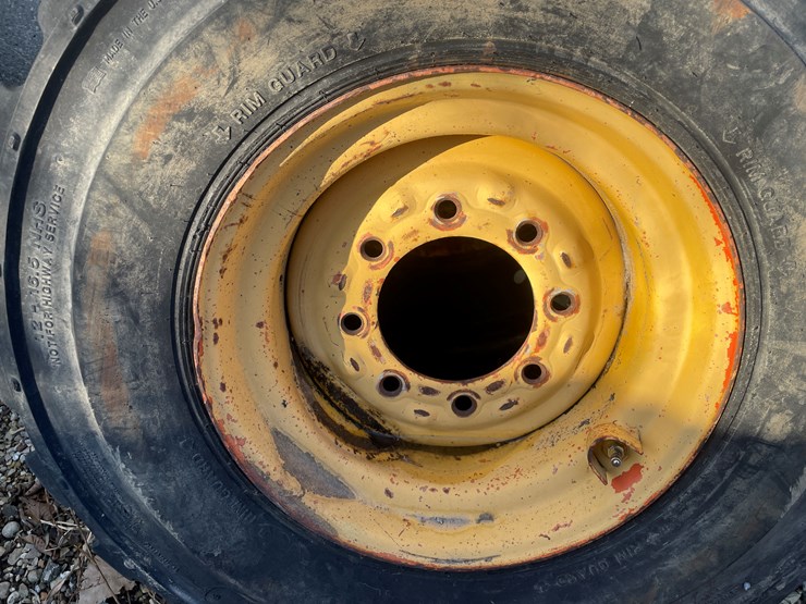#6031-•-(3)-skidsteer-tires-on-8-bolt-rims-image-4