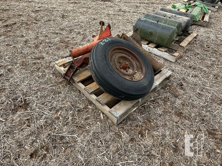 skid-with-implement-tire,-stands-image-2
