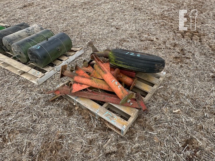 skid-with-implement-tire,-stands-image-1