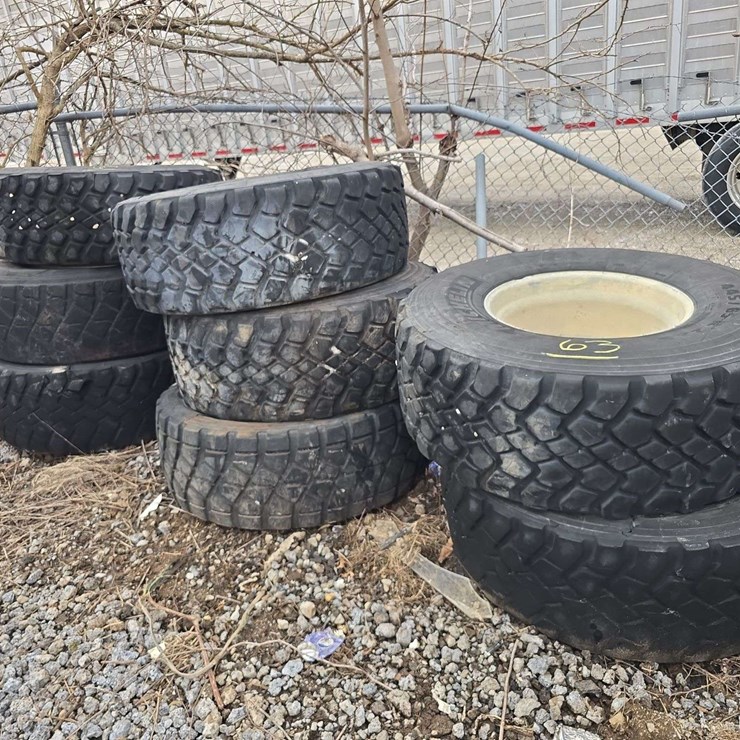 8 445/65R22.5 tires on aluminum rims; some are off the bead and dry cracked