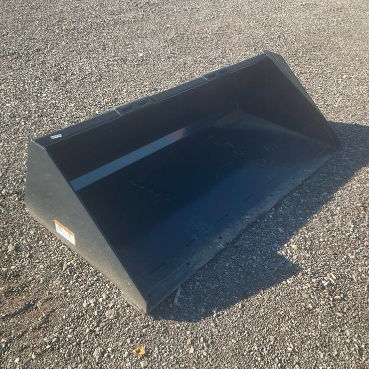 #1174 • Unused Wolverine Skid Steer Track Duty Bucket Attachment