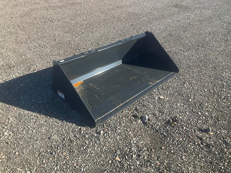 #1172-•-unused-wolverine-skid-steer-track-duty-bucket-attachment-image-1