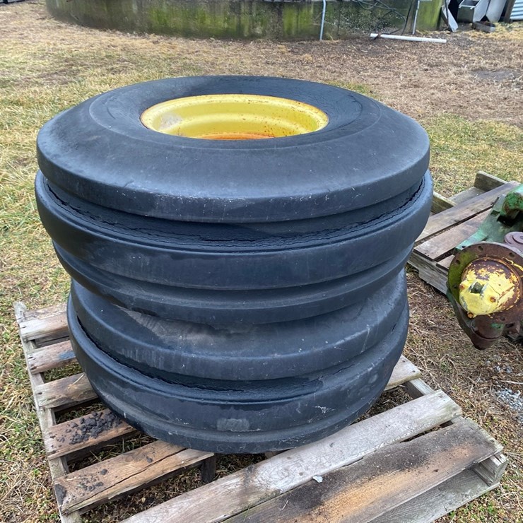 2 - 8 bolt big center rims with 14L - 16.1 SL tires