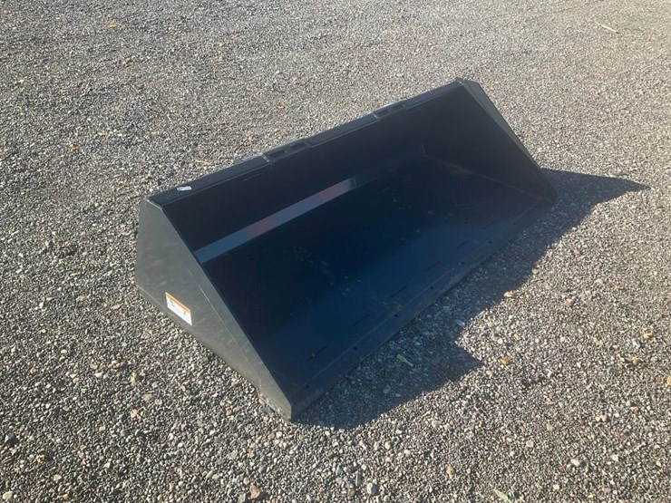 #1175-•-unused-wolverine-skid-steer-track-duty-bucket-attachment-image-1