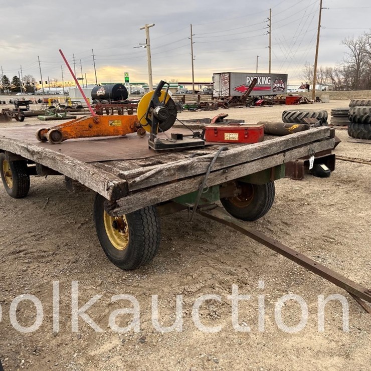 2215 - HAY WAGON ON JOHN DEERE RUNING GEAR - FROM THE LARRY POLK ESTATE
