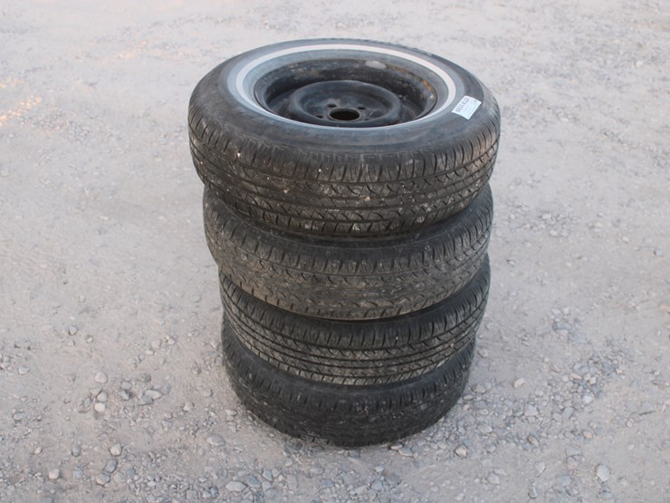 #3059-•-p215/75-r14-tires-on-5-lug-rims-(4-count)-image-1