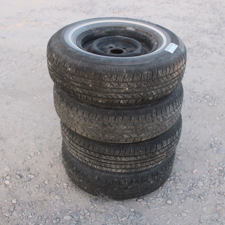 #3059 • P215/75 R14 Tires On 5 Lug Rims (4 Count)