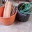2--tubs-of-wood-stakes-&-garden-hose-image-1