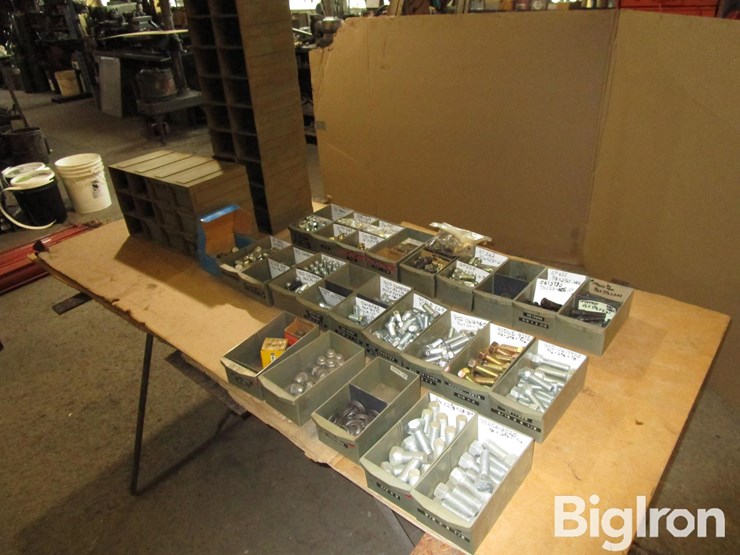 large-assortment-of-wheel-studs,-lug-bolts,-lug-nuts,-and-washers-image-1