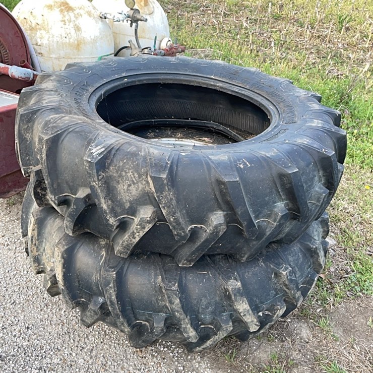 2 tractor tires and 1 wheel