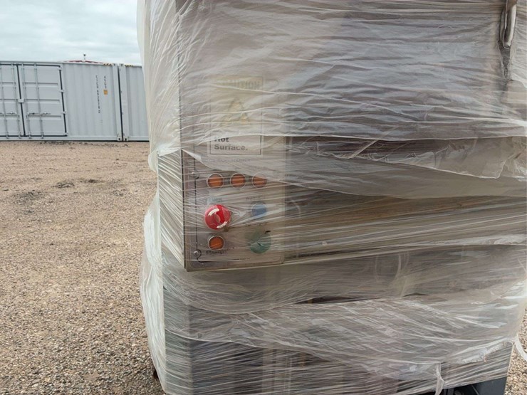 large-industrial-metal-cabinet-with-piping-and-protective-wrap-image-9