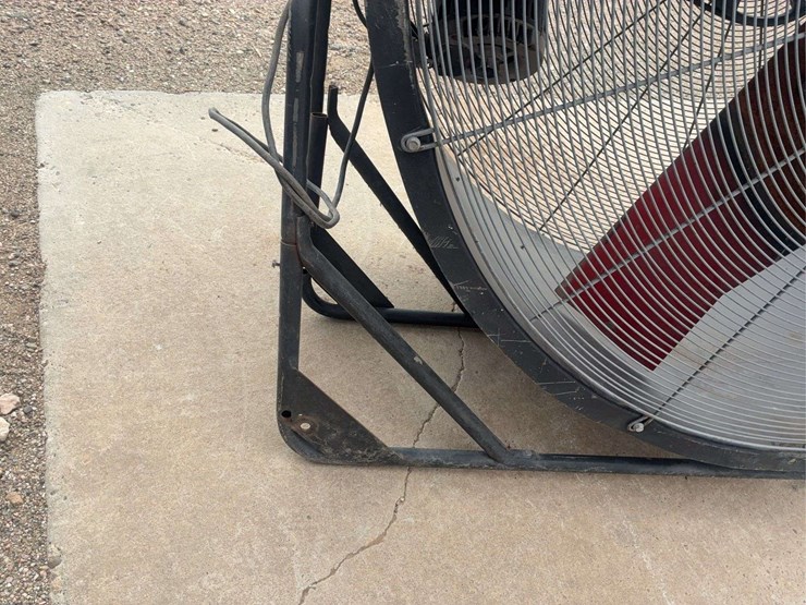 large-industrial-floor-fan-with-metal-frame-and-red-blades-image-3