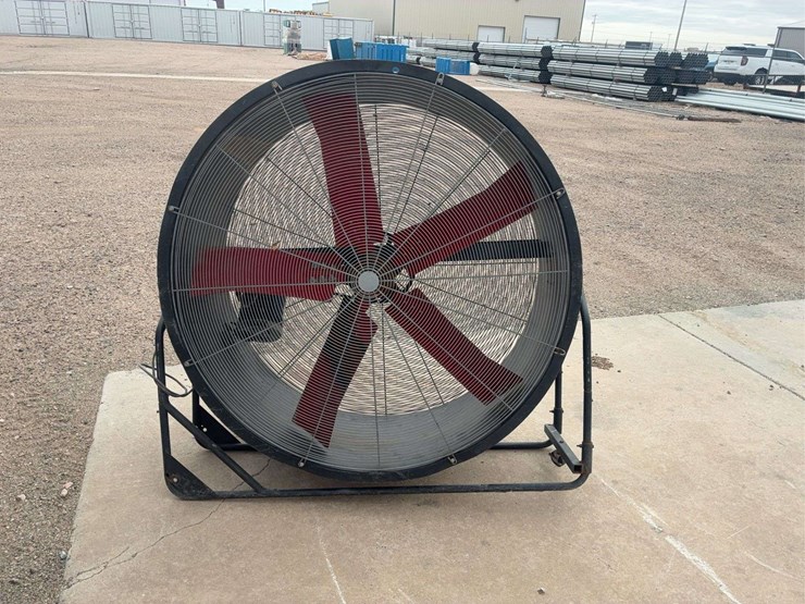 large-industrial-floor-fan-with-metal-frame-and-red-blades-image-1