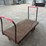heavy-duty-steel-platform-cart-with-dual-handles-and-cast-iron-wheels-image-4