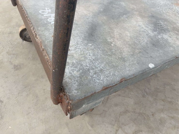 heavy-duty-steel-platform-cart-with-dual-handles-and-four-wheels-image-8